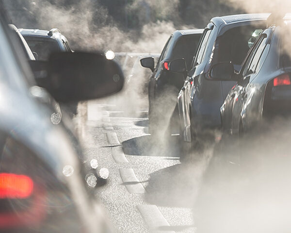 cars exhaust stuck in traffic